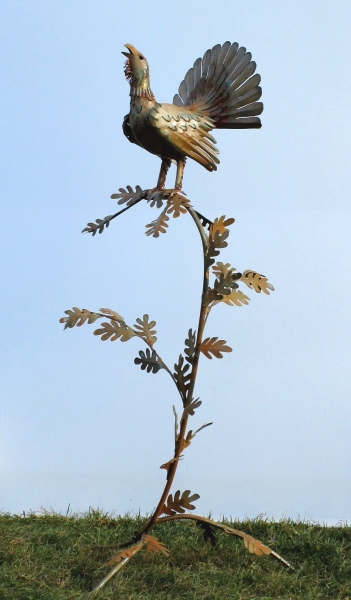Capercaillie in tree sculpture